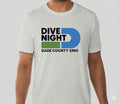 Person wearing a silver t-shirt with 'Dive Night Dade County Emo' design on a light gray background